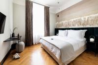 A bed or beds in a room at Zola Hotel - Palais de Bohème Adults Only