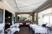 a dining room with white tables and chairs at Haddington House in Dun Laoghaire