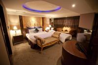 Tempat tidur dalam kamar di Taipei Lotty Hotel