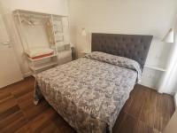 Posteľ alebo postele v izbe v ubytovaní Sorrento Punto It Apartment