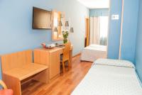 A bed or beds in a room at Reino de Granada