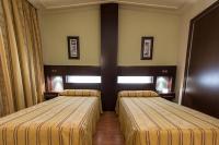 Postel nebo postele na pokoji v ubytování Hotel Los 5 Pinos