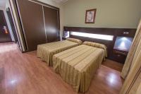 Postel nebo postele na pokoji v ubytování Hotel Los 5 Pinos