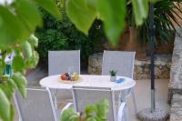 Zahrada ubytování Maria & Manos Guest House, Agios Onoufrios beach
