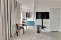 Televízia a/alebo spoločenská miestnosť v ubytovaní Comfort Apartments Granaria