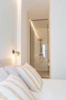 Postel nebo postele na pokoji v ubytování Suites Alfonso X