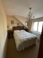 Ein Bett oder Betten in einem Zimmer der Unterkunft Le Grand Chalet