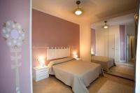 A bed or beds in a room at SUITE MORGANA in San Zeno
