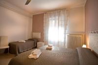 A bed or beds in a room at SUITE MORGANA in San Zeno