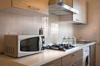 A kitchen or kitchenette at SUITE MORGANA in San Zeno