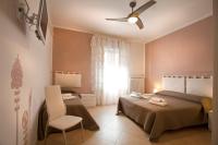 A bed or beds in a room at SUITE MORGANA in San Zeno