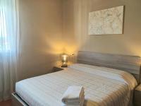 Posteľ alebo postele v izbe v ubytovaní Sirmione Acque del Garda Apartments