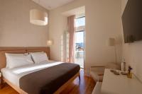 Postel nebo postele na pokoji v ubytování Memoria Lisboa FLH Hotels