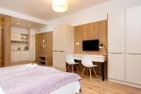 TV a/nebo společenská místnost v ubytování Business Studio Apartments Wolska by Noclegi Renters