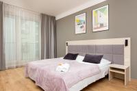 Postel nebo postele na pokoji v ubytování Business Studio Apartments Wolska by Noclegi Renters