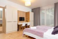 Postel nebo postele na pokoji v ubytování Business Studio Apartments Wolska by Noclegi Renters