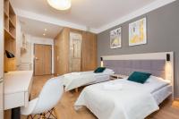 Postel nebo postele na pokoji v ubytování Business Studio Apartments Wolska by Noclegi Renters
