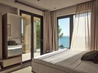 Postel nebo postele na pokoji v ubytování Uparati villa - Hilltop Sea View Retreat