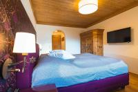 Posteľ alebo postele v izbe v ubytovaní Chalet Crown of the Alps by we rent