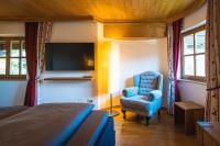 Televízia a/alebo spoločenská miestnosť v ubytovaní Chalet Crown of the Alps by we rent