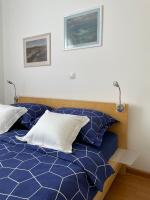 Posteľ alebo postele v izbe v ubytovaní LIPA Apartment