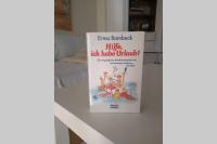 a book sitting on a counter next to a door at Evita Wörthersee in Krumpendorf am Wörthersee