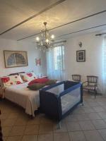 A bed or beds in a room at La casa tra i vigneti
