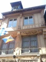 a flag flying in front of a building at Le Studio du Gouverneur in Honfleur