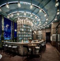 a bar in a restaurant with a bunch of lights at Four Seasons Hotel Hong Kong in Hong Kong