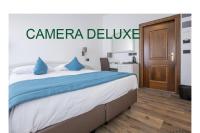 Ein Bett oder Betten in einem Zimmer der Unterkunft Albergo Cappello e Cadore