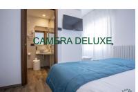 Ein Bett oder Betten in einem Zimmer der Unterkunft Albergo Cappello e Cadore