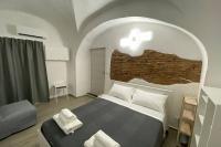 Łóżko lub łóżka w pokoju w obiekcie Catania Dammuso house
