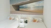 Postel nebo postele na pokoji v ubytování Casa Fuerte Playa