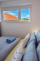 A bed or beds in a room at Zsuka apartman free parking