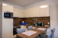 A kitchen or kitchenette at Zsuka apartman free parking