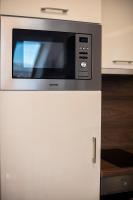 A kitchen or kitchenette at Zsuka apartman free parking
