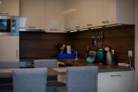 A kitchen or kitchenette at Zsuka apartman free parking
