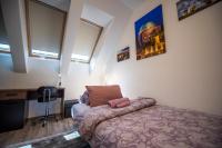 A bed or beds in a room at Zsuka apartman free parking
