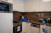 A kitchen or kitchenette at Zsuka apartman free parking