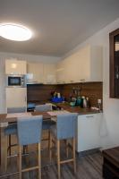 A kitchen or kitchenette at Zsuka apartman free parking