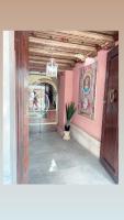 a hallway with a door and a potted plant at Sacristia de Santa Ana in Seville