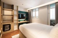 KēSa House, The Unlimited Collection managed by The Ascott Limitedにあるベッド