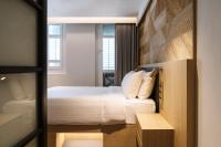 KēSa House, The Unlimited Collection managed by The Ascott Limitedにあるベッド