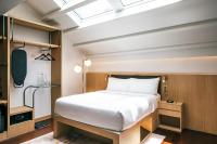 KēSa House, The Unlimited Collection managed by The Ascott Limitedにあるベッド
