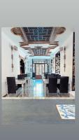 a dining room with tables and chairs and a ceiling at Sacristia de Santa Ana in Seville