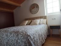 Postel nebo postele na pokoji v ubytování Casa da Costa - Apartamento con terraza y vistas al mar