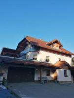 a large white house with a red roof at Ferienwohnung Familie Pichler in Neumarkt in Steiermark