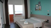 Posteľ alebo postele v izbe v ubytovaní Hotel Palazzo Caveja