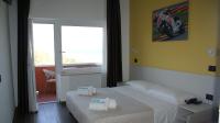 Posteľ alebo postele v izbe v ubytovaní Hotel Palazzo Caveja