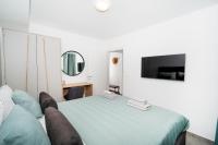 TV a/nebo společenská místnost v ubytování Apartments Palma Rabac